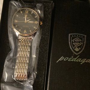 Poedagar mens watch. Silver tone, with calendar.  New without tags.